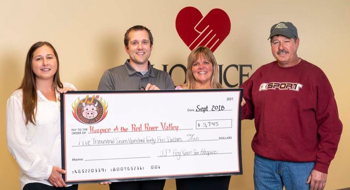 JJ's Hog Roast 2018 check presentation to Hospice of the Red River Valley